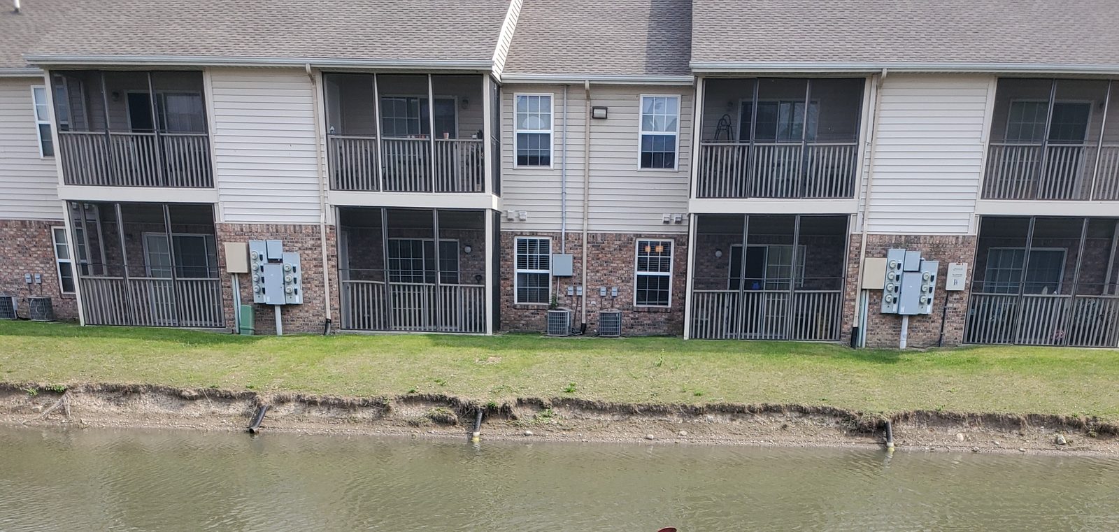 Eroded pond bank prior to stabilization