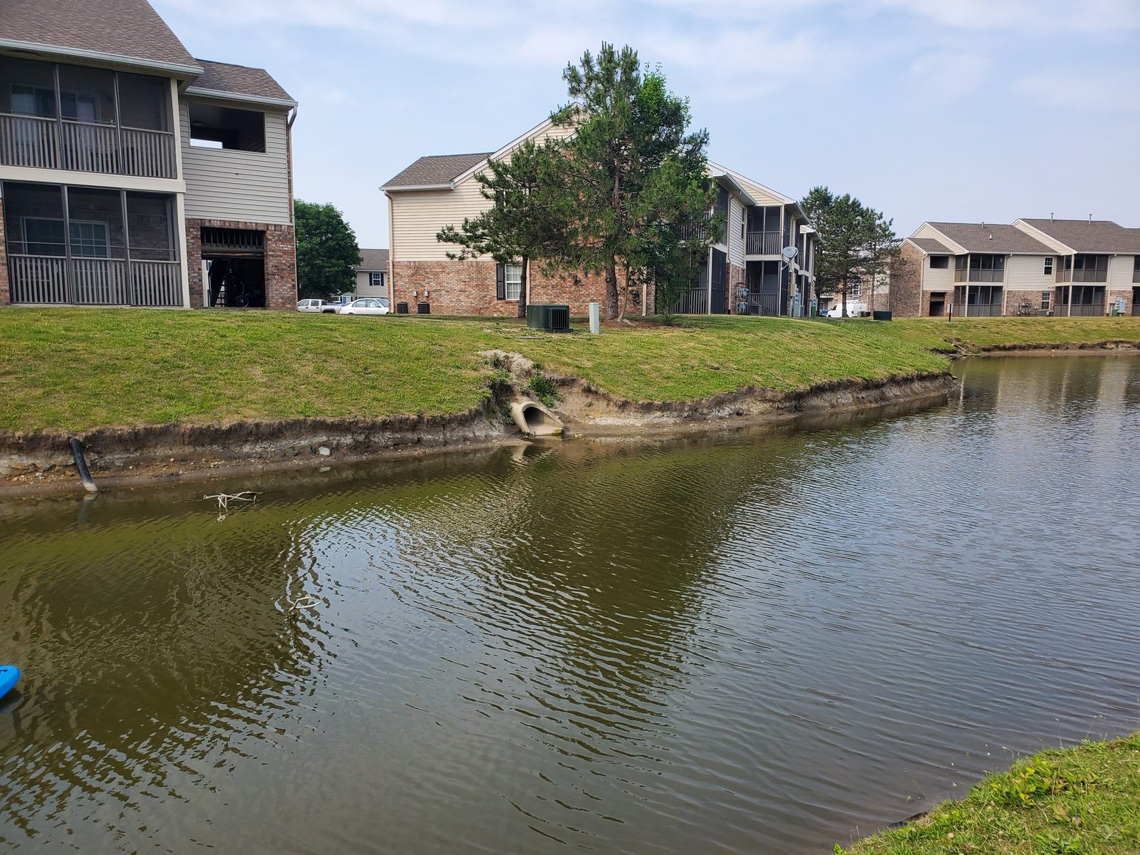 Full pond view showing erosion extent