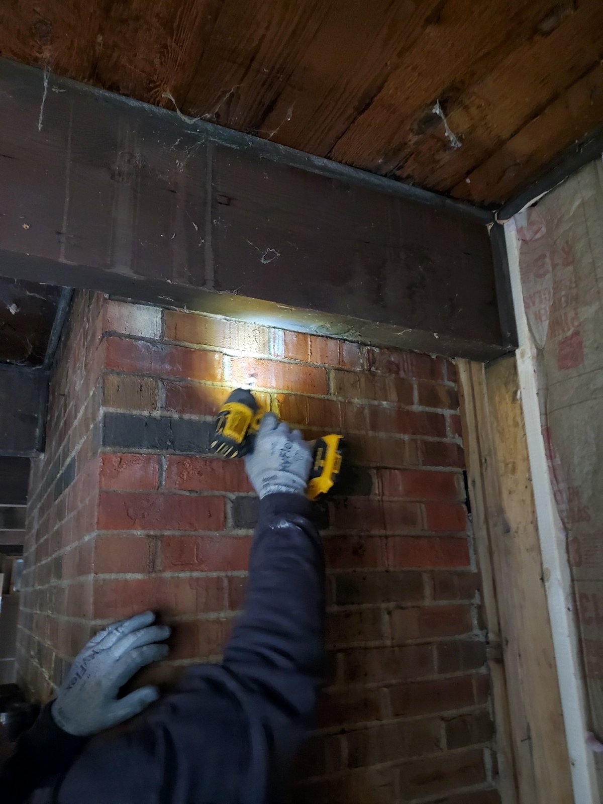 Construction worker on rooftop during remodel